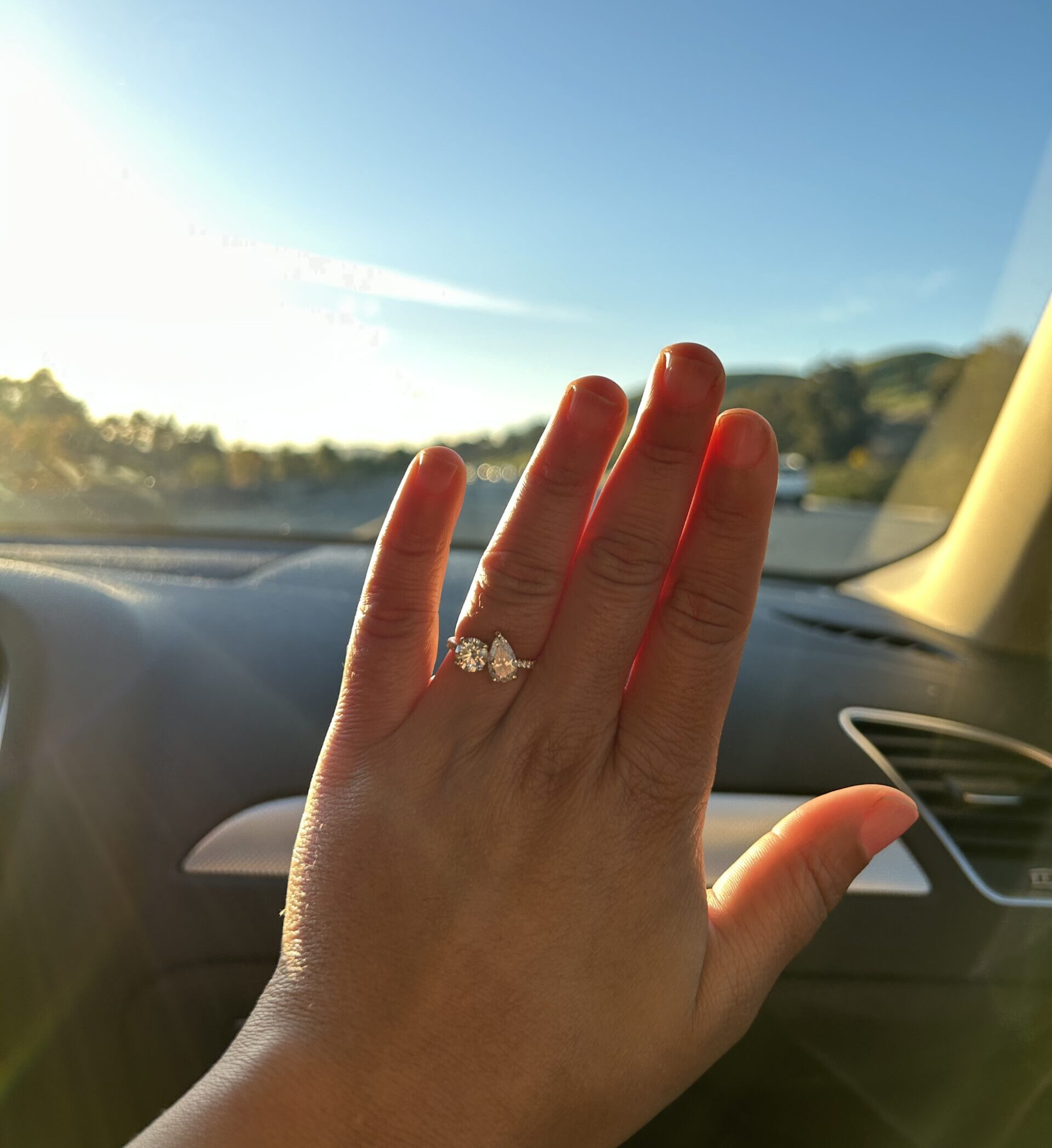 A photo of my engagement ring on my hand